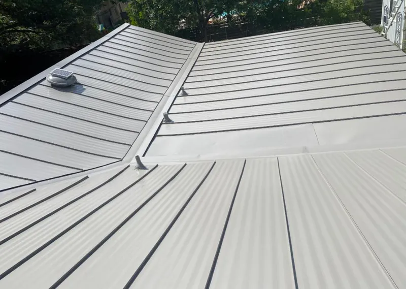 Solar attic fan installed on a metal roof for Roof Ventilation in Waimalu